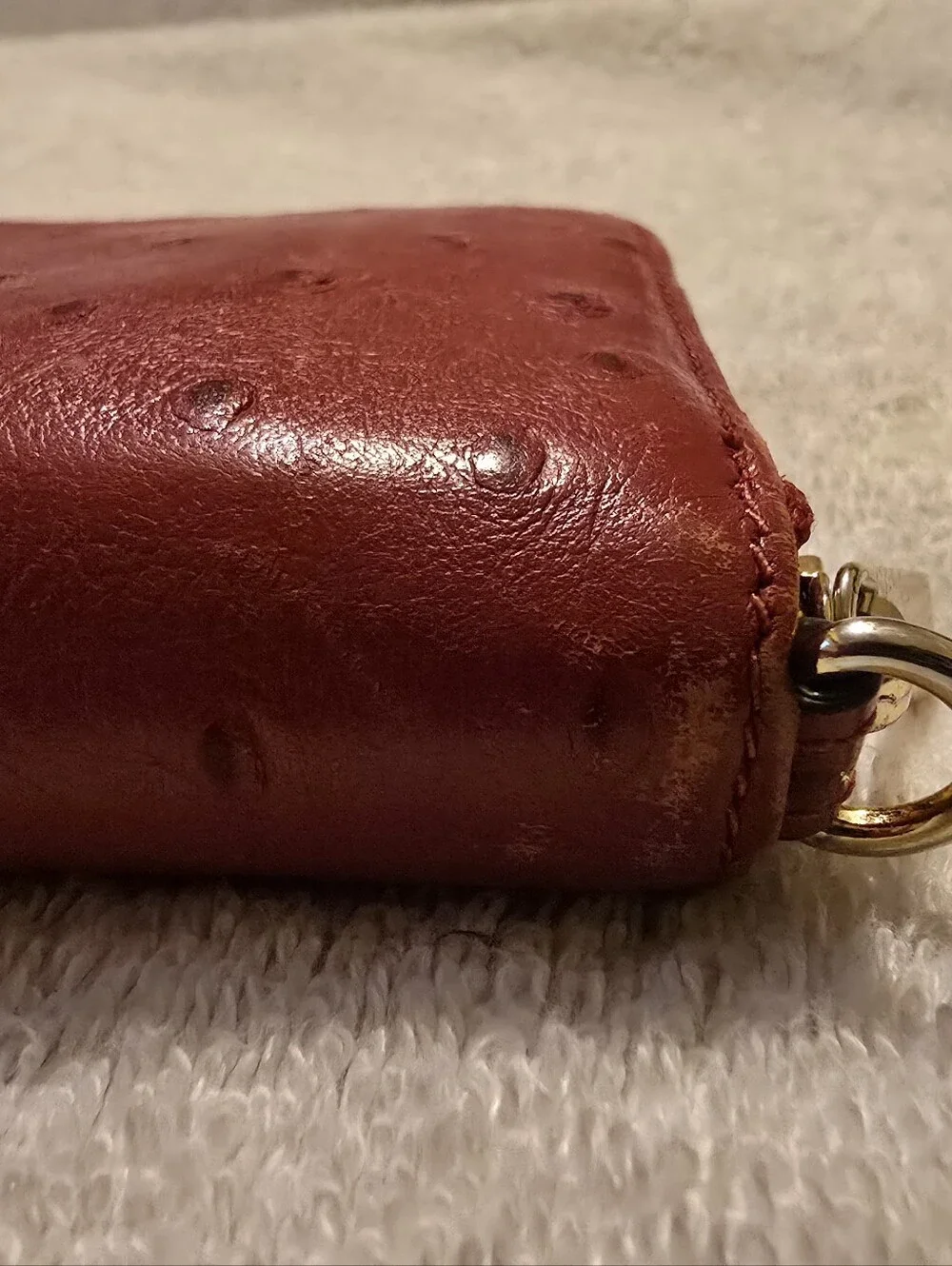 Michael Kors Red ostrich-patterned zip-around wallet featuring 1981 Goldtone